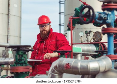 Oil And Gas Industry Worker. Engineer Working On Pipeline Equipment For Oil And Gas Company.