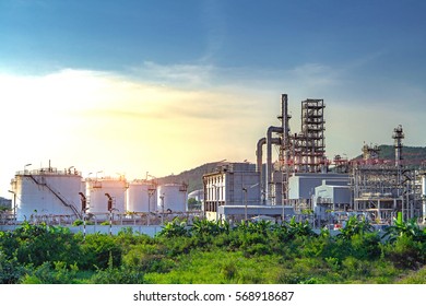 Oil and gas industry,refinery factory,petrochemical plant area at Sunset with blue sky - Shutterstock ID 568918687