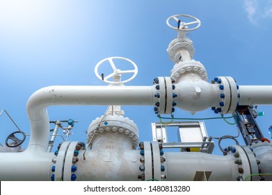 Oil and gas processing plant with pipe line valves.Industrial zone, Steel pipelines and valves blue sky.Oil pipeline valves in the oil and gas industry.  