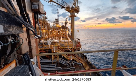 Oil and gas processing platform FPSO offshore Terengganu Malayia at open sea in sunrise blue sky
