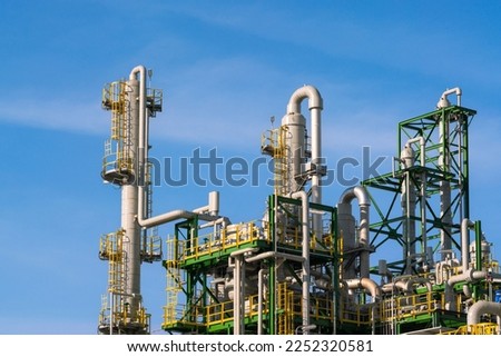 oil and gas tank distillation reactor column in chemical refinery industry petrochemical business to pipeline and storage tank for transportation network ecosystem energy concept