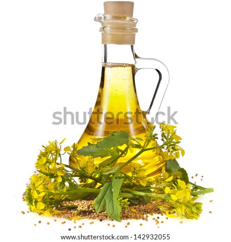 oil glass jar and mustard seeds with flower isolated on white background