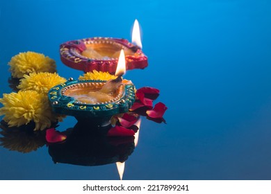 Oil lamps lit during diwali celebration - Shutterstock ID 2217899241