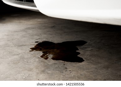 Oil Leak Or Drop From Engine Of Car On Concrete Floor , Check And Maintenance Auto Service