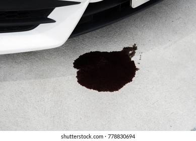 Oil Leak Or Drop From Engine Of Car On Concrete Floor , Check And Maintenance Auto Service