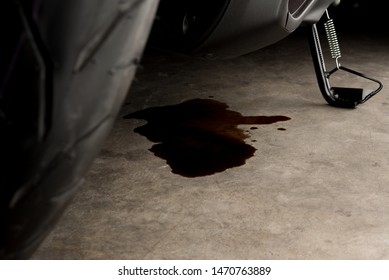 Oil Leak Or Drop From Engine Of Motorcycle On Concrete Floor , Check And Maintenance 