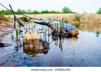 Oil Leak In The Reservoir. An Environmental Disaster. Protection Of Water Bodies From Pollution.