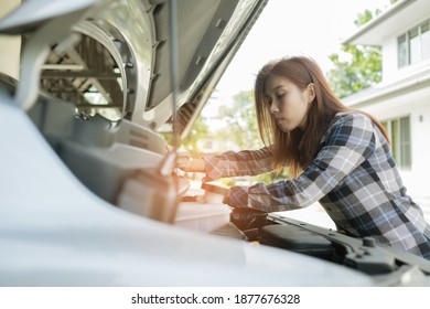 Woman checking Oil Level In A Car, Change Oil Car
