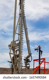 Oil Loading Terminal Of Caspian Sea. Bautino Bay. Loading Arm Close Up Photo. Fire Sensor Right. Blue Sky.