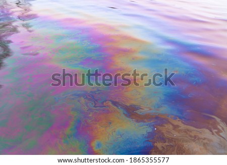 Oil petrol water pollution. Ecological disaster. Slick industry oil fuel spilling water pollution. Water with patches of gasoline and oil. Ecological catastrophe.  Concept of environmental problems