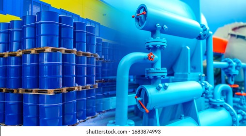 Oil pipeline. Concept is the transportation of petrolium to a warehouse through a pipeline. Equipment for packing oil into barrels. Oil barrels are stored in three levels. Petrolium product storage