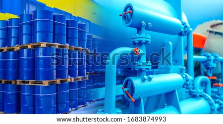 Oil pipeline. Concept is the transportation of petrolium to a warehouse through a pipeline. Equipment for packing oil into barrels. Oil barrels are stored in three levels. Petrolium product storage