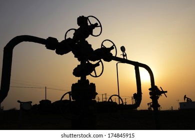 Oil pipeline valve features under the setting sun  