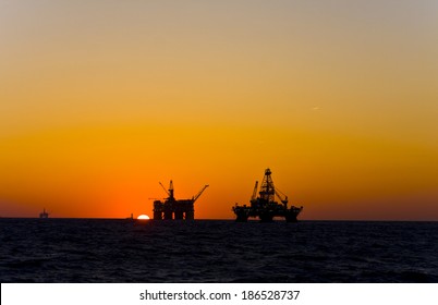 Oil Platform Silhouette In Gulf Of Mexico