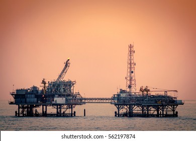 Oil Platform Silhouette In Gulf Of Mexico