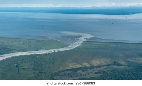 Oil Platforms in Cook Inlet basin, Middle Ground Shoal, Alaska. McArthur River with glacial sediment flows into Cook Inlet opposite of Nikiski on the Kenai Peninsula. 