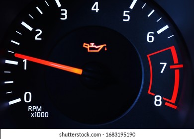 Oil pressure warning light illuminated on dashboard.  - Shutterstock ID 1683195190