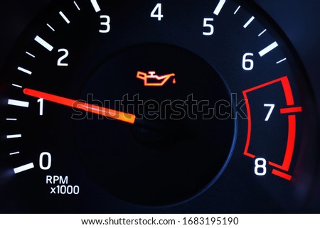 Oil pressure warning light illuminated on dashboard. 