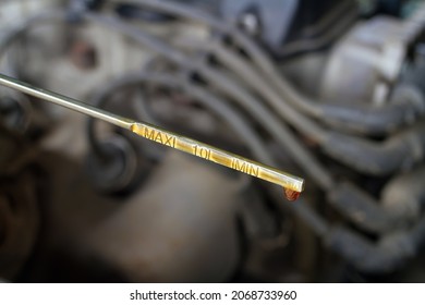 Oil probe of the car on the background of the engine. Measurement of the oil level in the engine. - Powered by Shutterstock