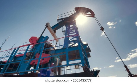 oil production a business lifestyle. silhouette of an oil and gas drilling rig in the sunset glare. oilfield extraction concept. oil pump business. Oil pumping plant - Powered by Shutterstock