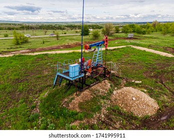 Oil Pump Jack Rocking. Rocking Machines For Power Generation. Extraction Of Oil. Aerial View.