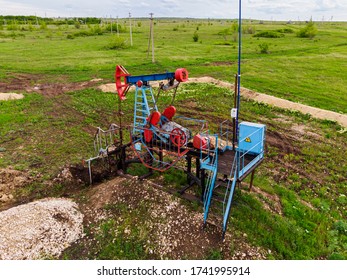 Oil Pump Jack Rocking. Rocking Machines For Power Generation. Extraction Of Oil. Aerial View.