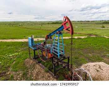 Oil Pump Jack Rocking. Rocking Machines For Power Generation. Extraction Of Oil. Aerial View.