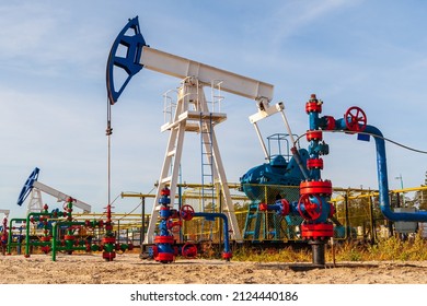 Oil pumping chair in the fields of Siberia. Oil and gas industry in Russia.