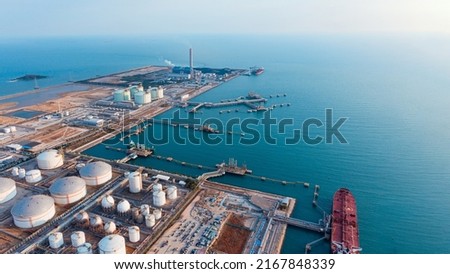 oil refinery of business logistic sea going ship, Crude oil tanker lpg ngv at night Group Oil tanker ship to Port of Singapore-Cargo ship import export. international order concept. evening time
