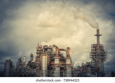 Oil Refinery, Oil Factory, Petrochemical Plant In Pasadena, Texas, USA. Air Pollution From Smoke Stacks Under Cloudy Sky. Vintage Tone.