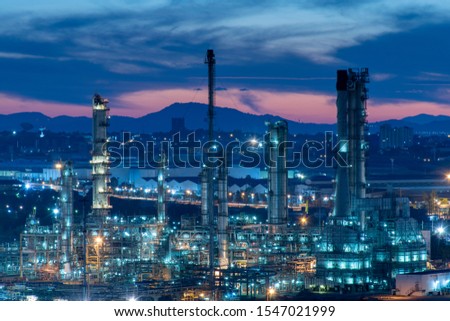 Oil refinery and petrochemical plants, natural gas tanks with steel pipe equipment in a blue background