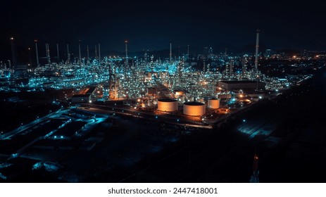 Oil refinery plant industry factory zone, oil and gas petrochemical industrial, oil storage tank and pipeline steel at night scene shot blue sky backgrounds, aerial view
 - Powered by Shutterstock