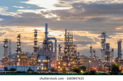 Oil Refinery Plant From Industry Zone, Aerial View Oil And Gas Industrial, Refinery Factory Oil Storage Tank And Pipeline Steel At Night.