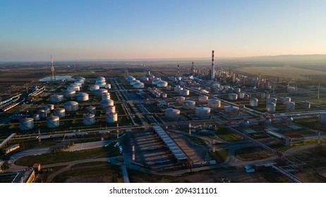 Oil Refinery Plant From Industry Zone, Aerial View Oil And Gas Petrochemical Industrial, Refinery Factory Oil Storage Tank And Pipeline Steel At Night, Ecosystem And Healthy Environment Concepts.