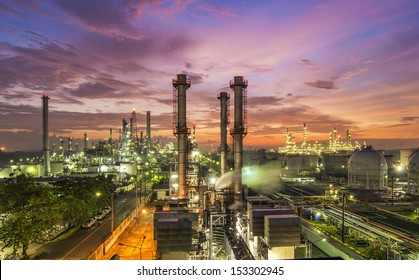 Oil refinery plant at sunset, The night view of petroleum and petrochemical factory with column drum and distillation construction. Gas, diesel and chemical business industry is important for economy.