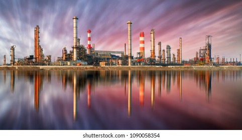 Oil Refinery at sunset with reflection