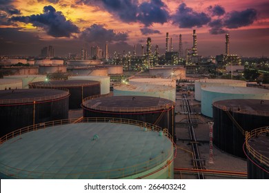 Oil refinery and oil thank in sunset background