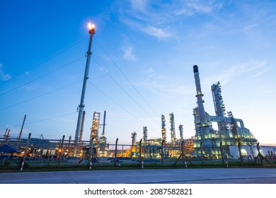 Oil refinery tower flare fire of petrochemistry industry in cloud sky morning