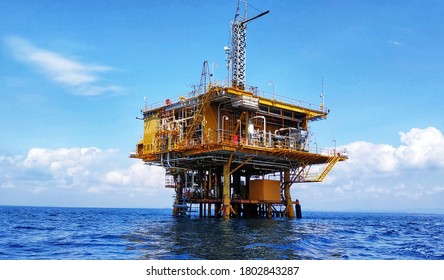 Oil Rig And Gas At Indonesia Sea Background, Yellow Construction At Blue Deep Sea