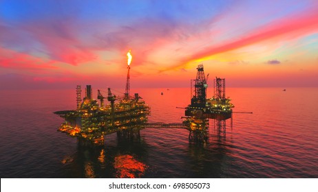 Oil Rig At Late Evening (offshore) Areal Photography During Sunset.