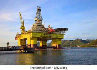 Oil Rig Near The Mountains In Norway.