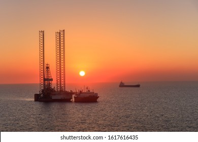 Oil Rig Platform In Sunrise. Persian Gulf