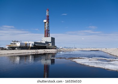 Oil Rig And Sludge Reservoir