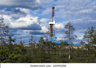 Oil rig and small forest on foreground
