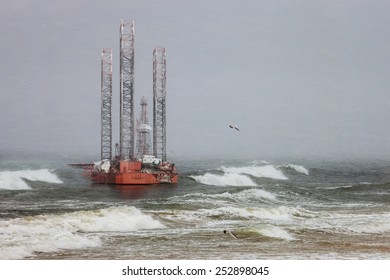 Oil Rig In A Winter Storm Day During A Violent Blizzard. 