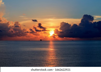 Oil Rigs And Oil Platforms At Gulf Of Mexico During Sunset