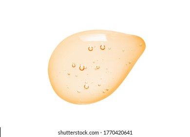 Oil Serum Gel Drop Isolated On White Background. Transparent Colored Liquid Cosmetic Cream With Bubbles Close-up. Skincare Product Macro Photography