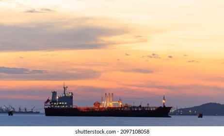 Oil Ship Offshore Construction Platform For Production Oil And Gas With Bridge At Twilight Golden Hour Sky Background 