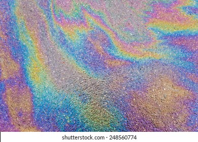 Oil Slick On The Asphalt Road Background