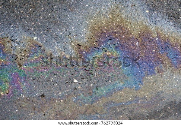 Oil slick on the\
asphalt road background
